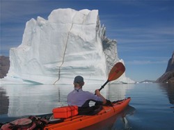 Paddling by iceberg , image by Dan Jones